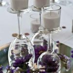wine glasses with candles and flowers
