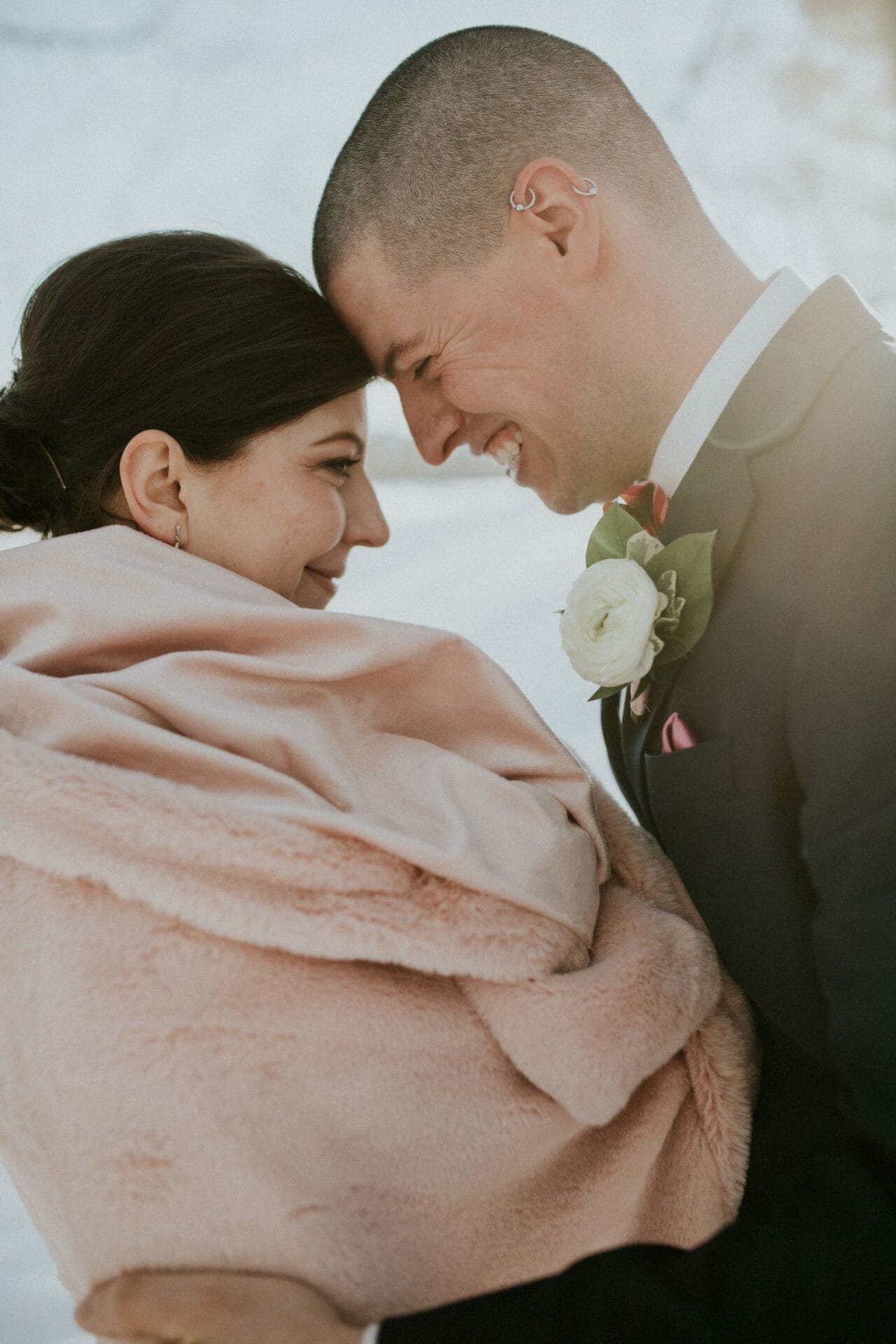 A couple laughing during an Edmonton elopement in Alberta.